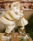 abbraccio natlizio. tra babbo natale e bimba, palette oro e glitter firmato nuvole di stoffa